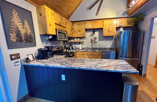 Idaho Springs Cabin | A River Front Mountain Luxury Cabin- Relaxing, Skiing, Rafting, Hot Tub, Sauna