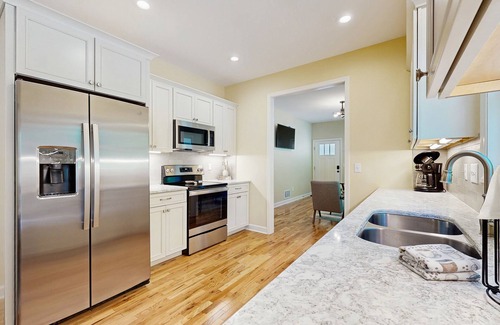 West Side Historic District Cottage | All-new cottage with deck, grill, & washer/dryer - near downtown & Rail Trail