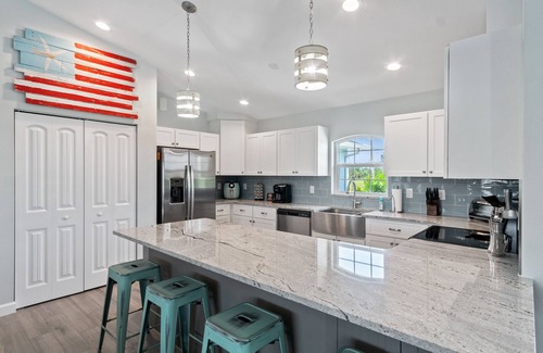 Pine Valley House | ALL the amenities! New home with hot tub, on canal, dock, pool heat included!