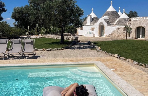 Ceglie Messapica Villa | ALMAPULIA beautiful trulli with private pool and veranda among Apulian olive trees