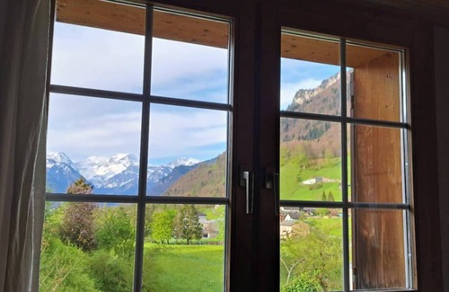 Schwanden House | Alpine Chalet with Mountain Views & Tranquillity