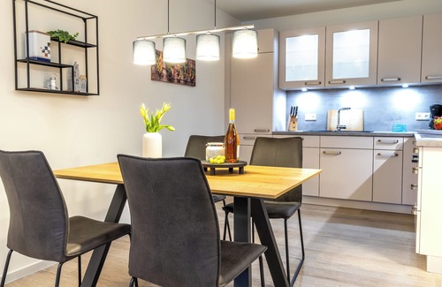 Dorumer Neufeld Apartment | Ankerpunkt Südost - Ferienwohnung mit Garten und Sauna