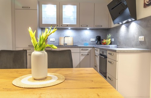 Dorumer Neufeld Apartment | Ankerpunkt Südost - Ferienwohnung mit Garten und Sauna