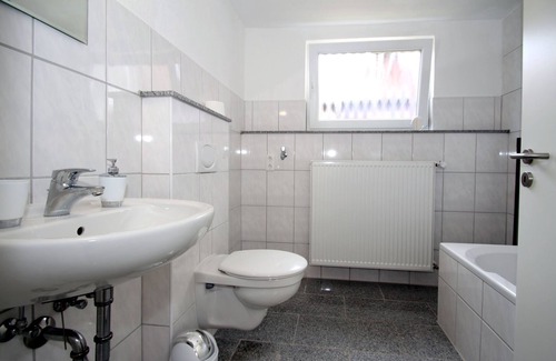 Carolinensiel Apartment | Apartment in Carolinensiel with a high chair and bed