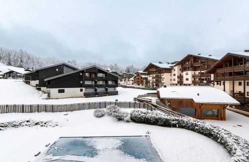 Les Esserts Apartment | Apartment in Morillon with Pool & Mountain Views