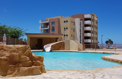 El Combate Apartment | Apartment in the Paradise with Ocean View, Pool, Wifi Ready TV