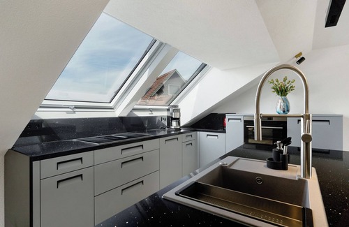 Rheinau Apartment | Apartment 'Moderne Offene Dachgeschoßwohnung' with Shared Pool, Shared Garden and Wi-Fi