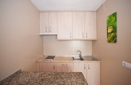 Santa Eulalia del Rio Apartment | Apartment Ses Veles 1 dormitorio close to the Beach with Sea View, Pool, Wi-Fi & Garden