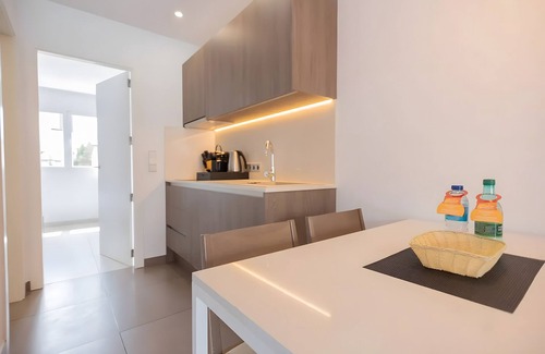 Cala Agulla Apartment | Apartment 'Standard 16' with Shared Pool, Wi-Fi and Air Conditioning