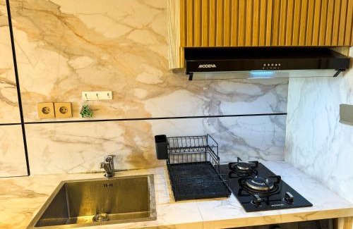 Pondok Aren Apartment | Apt Embarcadero 2BR with Netflix & Pool by Damaresa