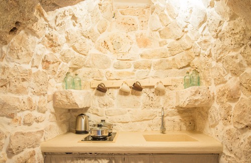 Ceglie Messapica House | arabesque trulli, 3 cones of which 2 communicating for a total of 5 beds