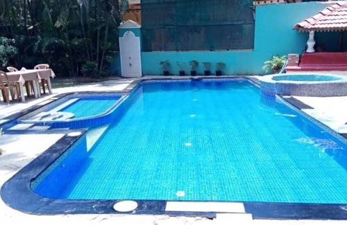 Betalbatim Apartment | Authentic Goa Home Surrounded by Coconut Palm Trees & Pool at Sandray