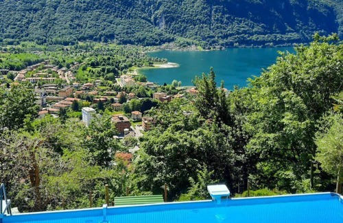 Porlezza House | Beautiful apartment in villa for 4 guests with WIFI, pool, TV, patio and pets allowed