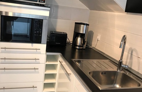 Playa del Aguila House | Beautiful bungalow with generous kitchen, sea view and beach/sea access