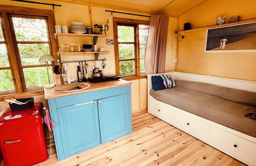 Oetzen Cabin | Beautiful circus wagon on the sheep pasture