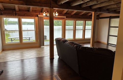 Ellsworth House | Beautiful private beach area within steps from the modern updated log home