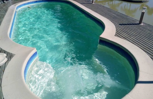 Aurora Cottage | Beautiful site with swimming pool and pond to relax in