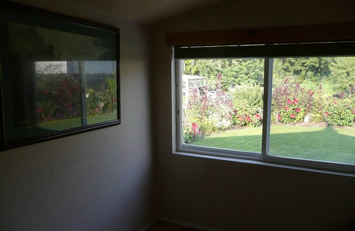 Brigham City House | Beautiful small Garden Surrounding This Little Home. Clean and Comfortable.