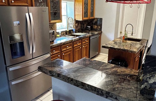 Alvin House | Beautiful Vacation Home ,Tropical Resort Pool with Waterfall and Heated Hot tub.