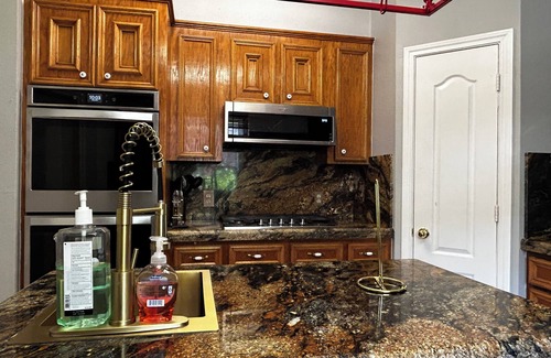 Alvin House | Beautiful Vacation Home ,Tropical Resort Pool with Waterfall and Heated Hot tub.