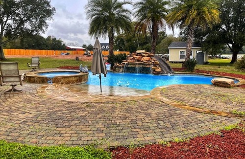 Alvin House | Beautiful Vacation Home ,Tropical Resort Pool with Waterfall and Heated Hot tub.