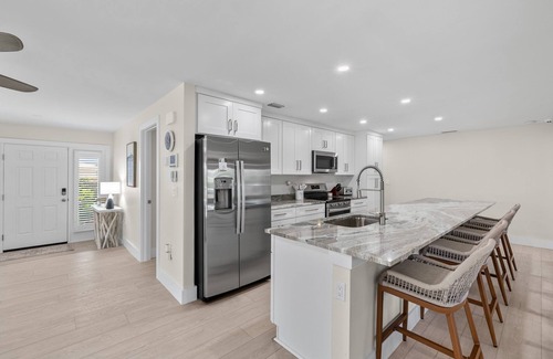 Shell Harbor House | Beautifully newly redesigned canal front pool home minutes to beach! NEW!