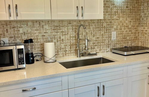 Greater Northdale Apartment | Bellagio a modern , spacious unit with a large balcony facing a golf course