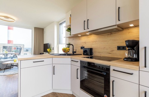 Marienleuchte Apartment | BeltBlick 24 - Roof terrace. Sea view. Sauna. Design.