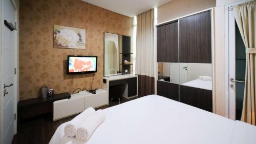 Surabaya Apartment | Best Location and Tidy 2BR Apartment at Trillium Residence By Travelio