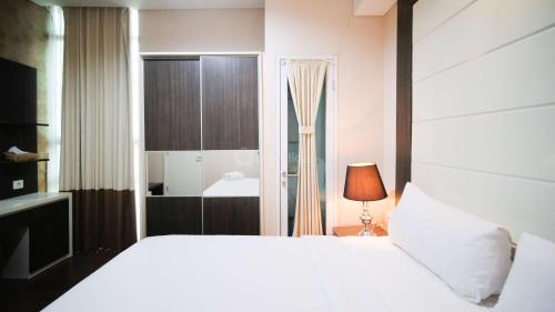 Surabaya Apartment | Best Location and Tidy 2BR Apartment at Trillium Residence By Travelio