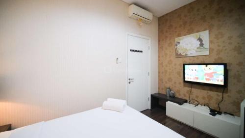 Surabaya Apartment | Best Location and Tidy 2BR Apartment at Trillium Residence By Travelio