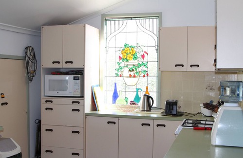 Rodds Bay House | Big inviting Queenslander overlooking the bay with sea breezes and water views