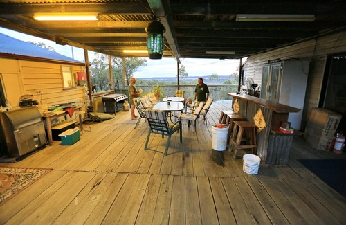 Rodds Bay House | Big inviting Queenslander overlooking the bay with sea breezes and water views