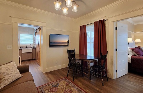 Historic Railroad District House | BookStayHop -RedTail Orliena Suite, Relaxing Hot tub and a Tesla Station