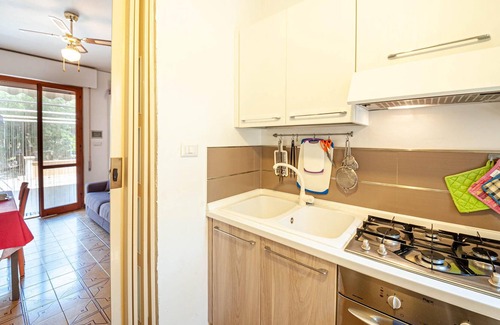 Centro Commerciale Apartment | Bright apartment with shared outdoor pool, just a few steps from the sandy beach.