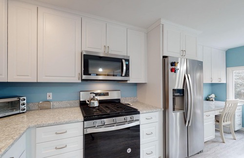 Warren Condo | Bright, mountain escape with pool, hot tub, fireplace, modern kitchen & balcony