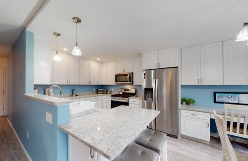 Warren Condo | Bright, mountain escape with pool, hot tub, fireplace, modern kitchen & balcony