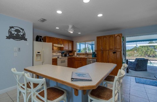 South Gulf Cove House | Canal Dreams a Gorgeous 3 BR/2 BA home with heated pool on the canal