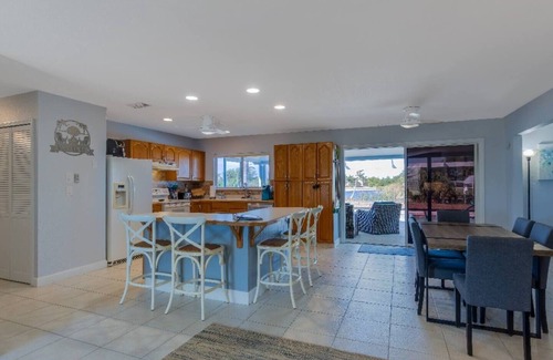 South Gulf Cove House | Canal Dreams a Gorgeous 3 BR/2 BA home with heated pool on the canal