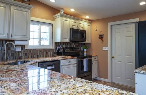 Bayshore Gardens House | CANAL FRONT W/DOCK, Water View, Dock your Boat, Free WIFI Dog - See Note Friendly!