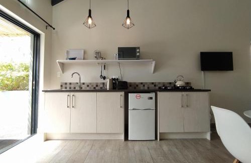 Robberg Beach Apartment | Capricorn Studio Two - 150m to Solar Beach, Patio & Braai, Wifi, DSTV & Netflix