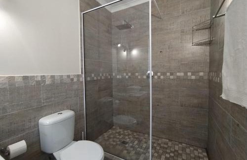 Robberg Beach Apartment | Capricorn Studio Two - 150m to Solar Beach, Patio & Braai, Wifi, DSTV & Netflix