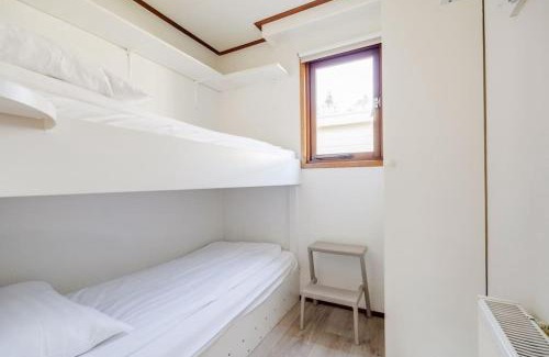 Krachtighuizen Ski Chalet | Chalet omringd door groen op de Veluwe
