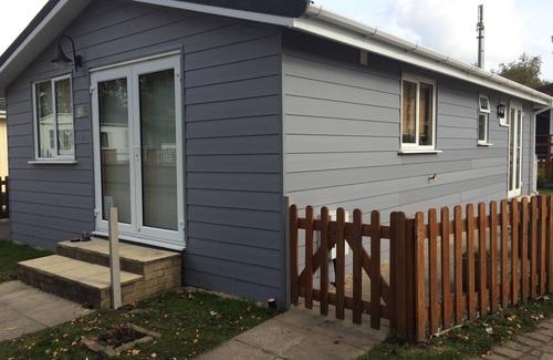 Matchams Ski Chalet | Chalet on small peaceful site with shared heated outdoor pool.