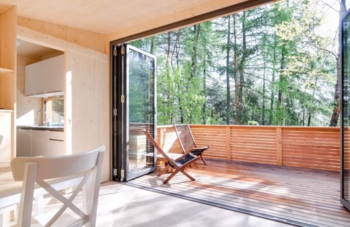 San Genesio Atesino Ski Chalet | Chalet on the edge of the forest with a large glass front