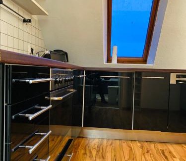 Nord-Mitte Apartment | Charmante Ferienwohnung mit Kaminofen