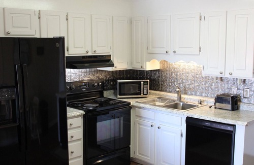 North Myrtle Beach Apartment | Charming 2-bedroom condo offering serene living with picturesque pond vistas, with a lovely pool!