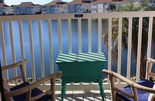 North Myrtle Beach Apartment | Charming 2-bedroom condo offering serene living with picturesque pond vistas, with a lovely pool!