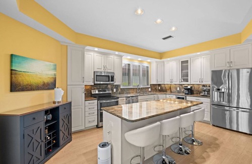Waters Edge House | Charming 3-bedroom lake house in Fort Myers with screened-in pool & hot tub.