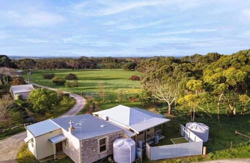 Macgillivray Cottage | Charming and Private Cottage with Fireplace for a Cozy Island Getaway.